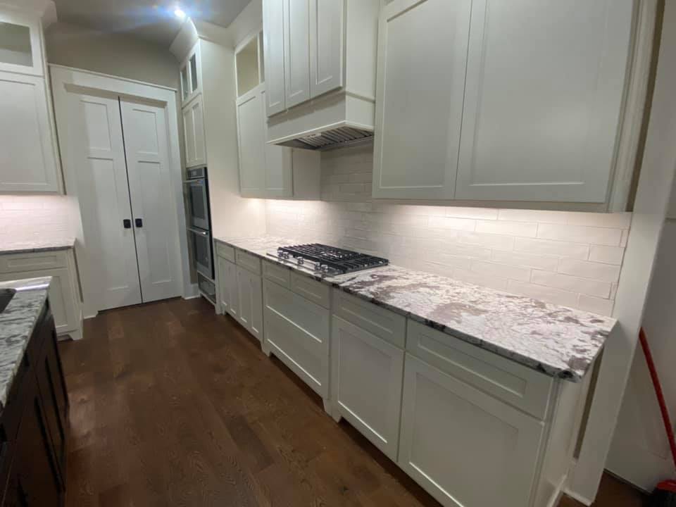 The Boone House in Oconee. A completely custom home. Photo of Kitchen range and granite countops