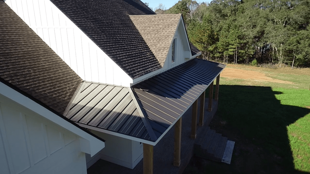 aerial view of front of home close up shot of covered metal roof porch