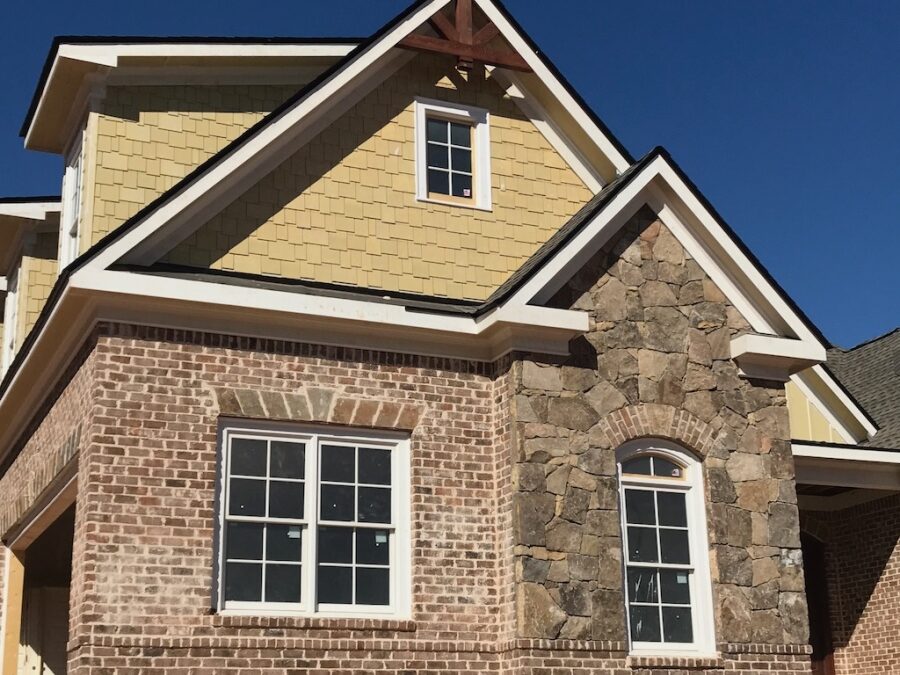 Photo of front area of brick home under construction